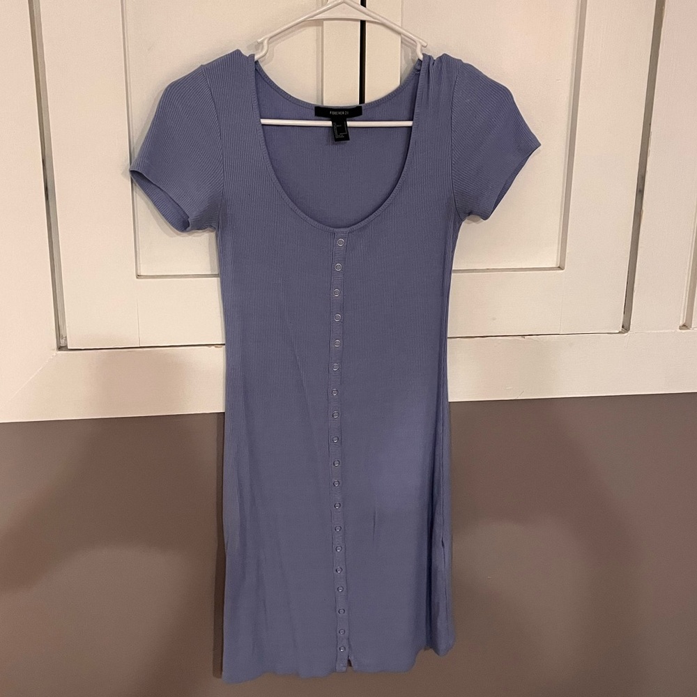 This is a blue body con above the knee dress